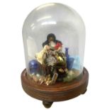 A glass dome on hardwood base, containing a diorama scene of a wooden peg doll in Victorian dress,