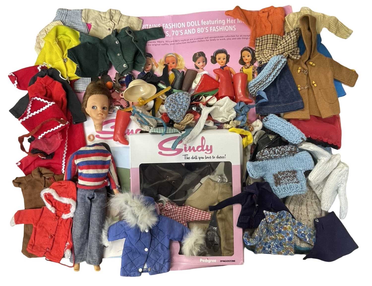 A vintage Sindy doll (a/f) together with a quantity of clothing