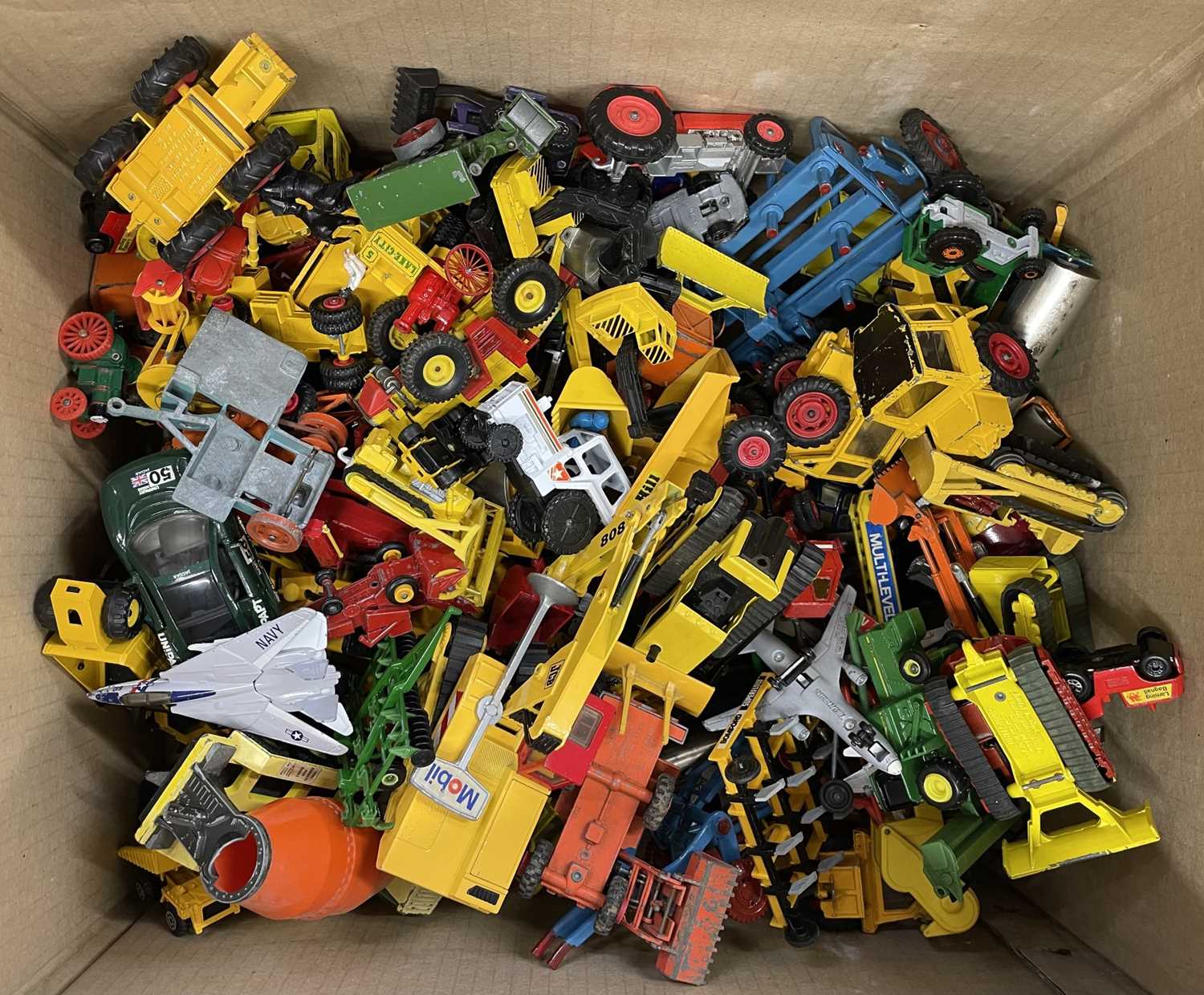 A large collection of various die-cast vehicles, mostly farming / construction.