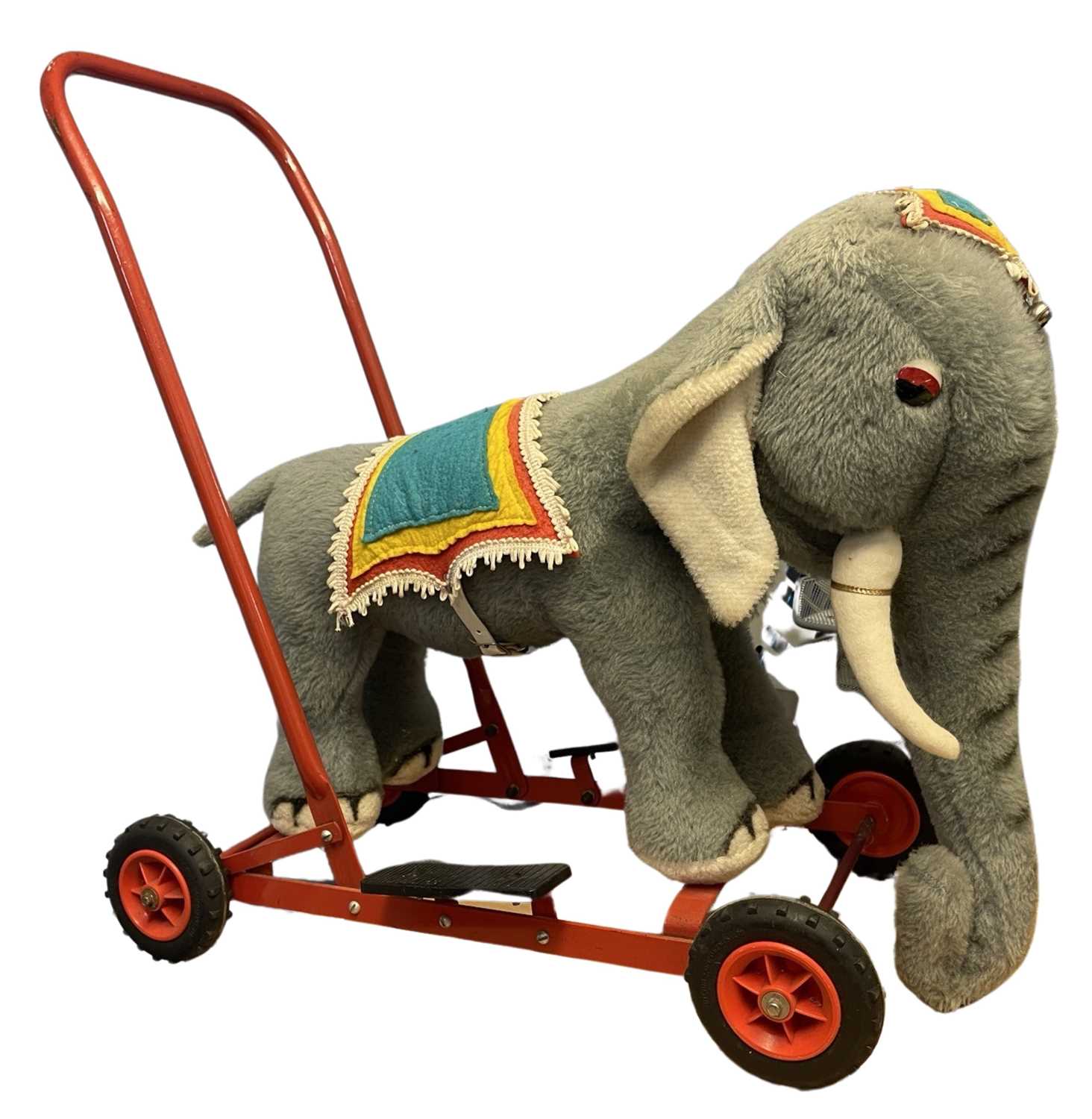 A vintage Merrythought walker / ride-on elephant, with original ironmongery and saddle