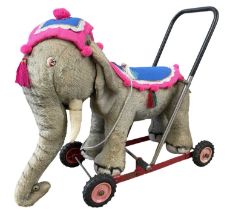 A vintage Merrythought ride-on / walker formed as a Circus elephant