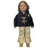 A bisque head Heubach Koppelsdorf doll, dressed in sailor's outfit. Marked to rear of head:
