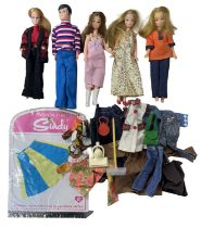 A collection of four vintage Pippa Dolls / one Pete doll, together with dolls clothing