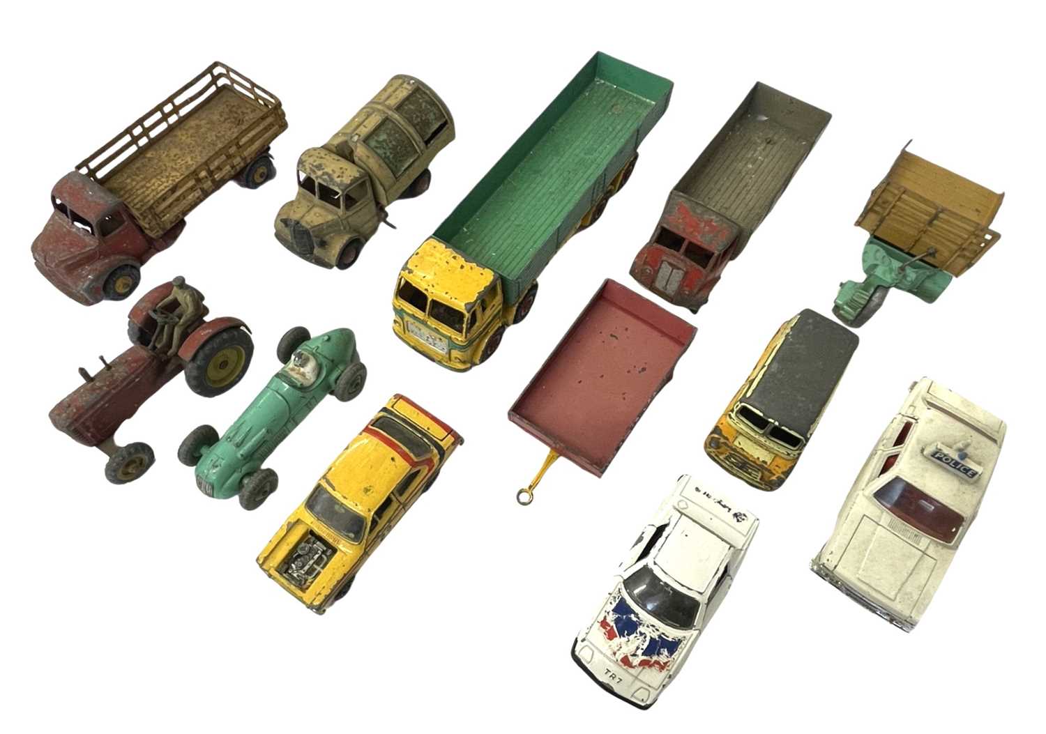 A collection of playworn die-cast Dinky toys