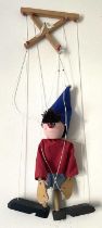 A scratchbuilt hand painted wooden marionette puppet formed as Enid Blyton's Noddy