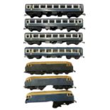 A collection of various unbranded 0 gauge rail corridors / carriages