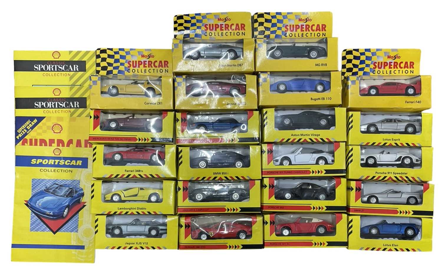 A collection of various boxed Shell and Maisto sportscars