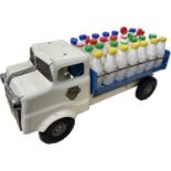 A c1950s Triang pressed steel milk float, with 28 original bottles with Triang branded caps.