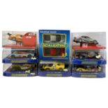 A collection of various cased Scalextric cars, plus two SCX examples