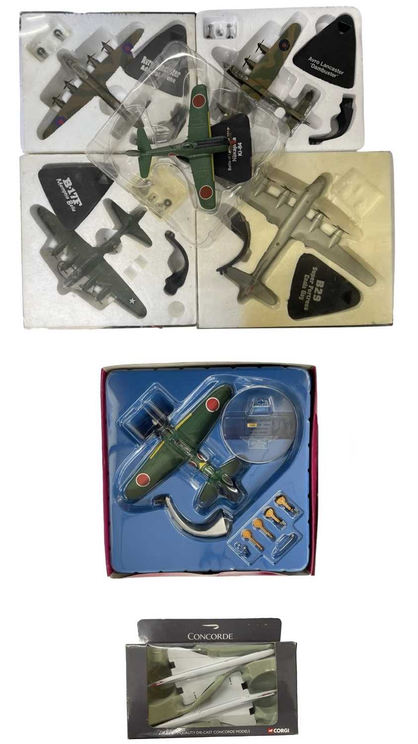 A collection of boxed die-cast aeroplane models with stands