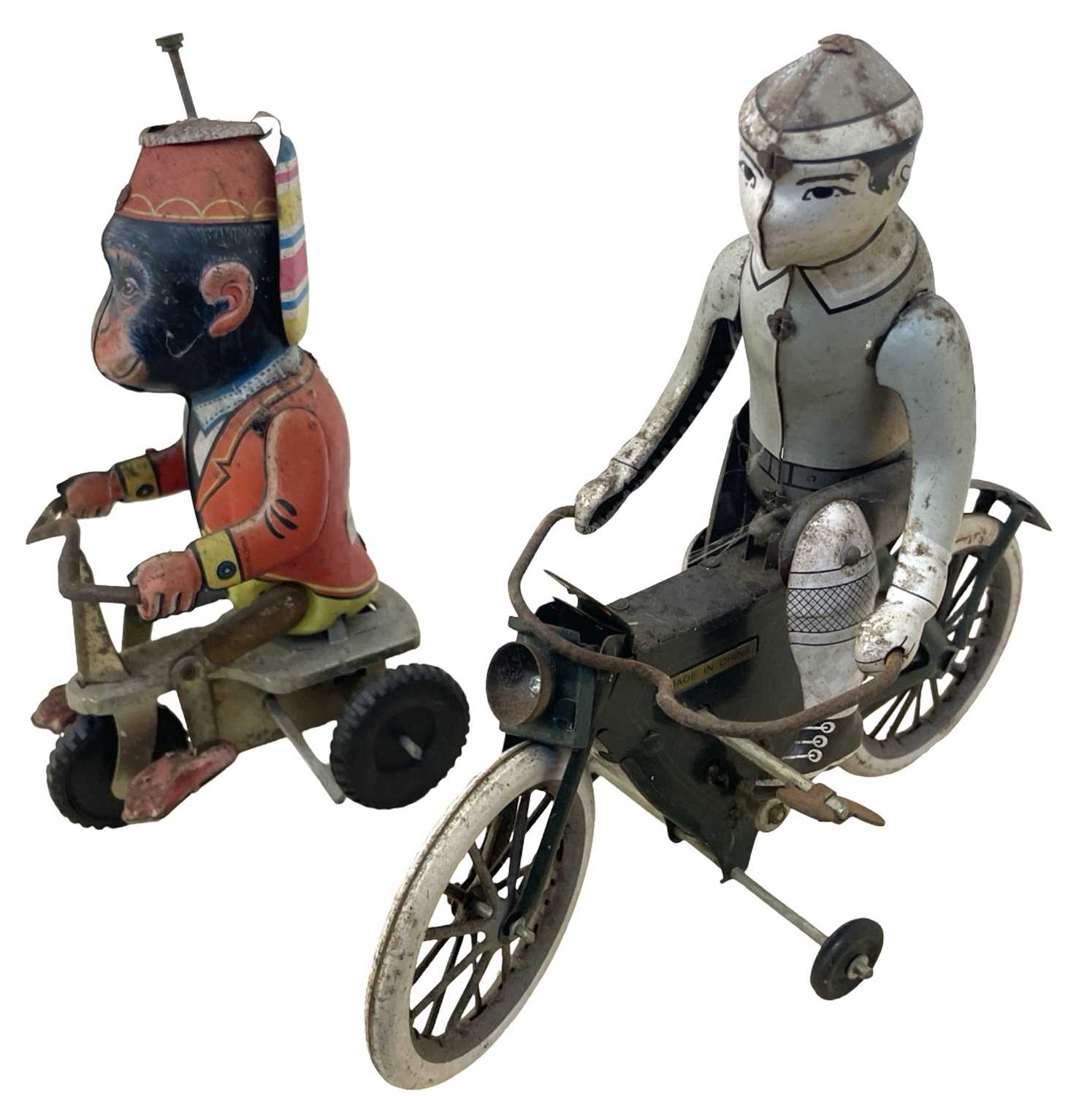 A pair of vintage Chinese tinplate toys, formed as a performing monkey and a gent on a bicycle (a/