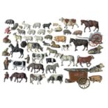A collection of various die-cast farm animals and figures, mostly Britains