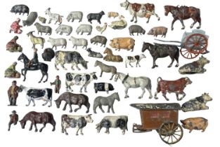 A collection of various die-cast farm animals and figures, mostly Britains