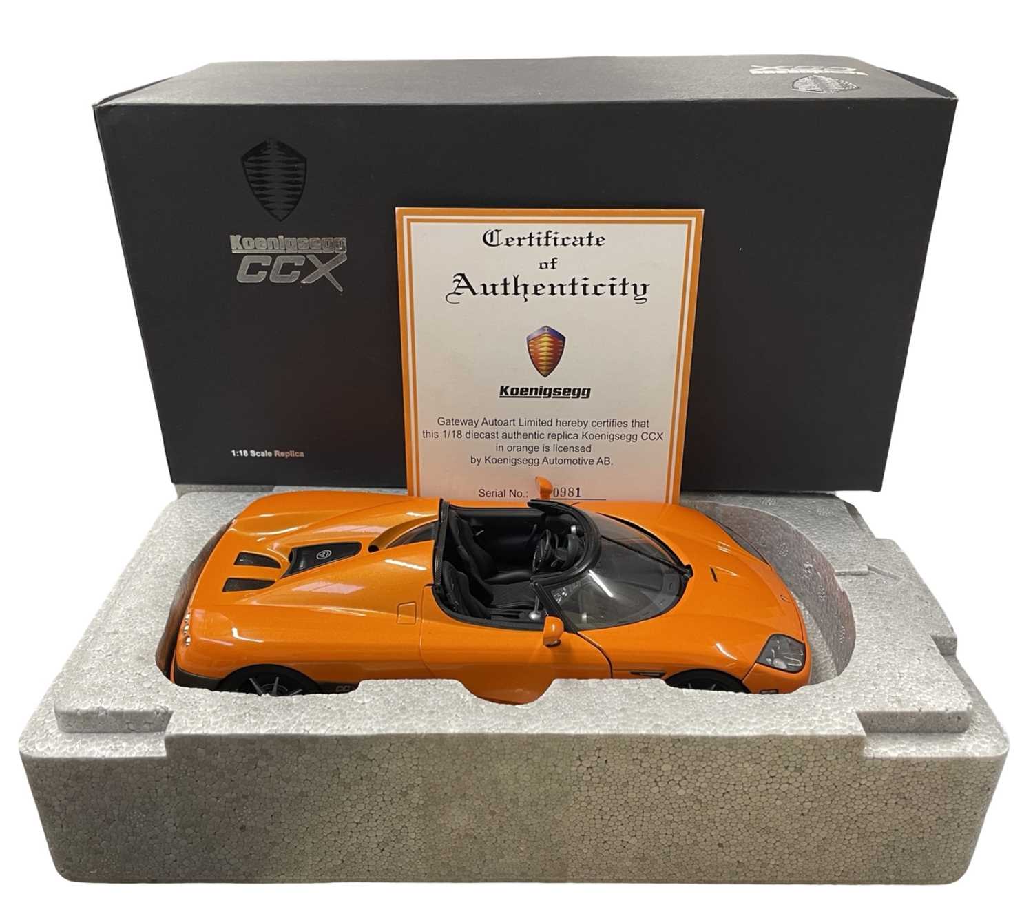 A boxed AutoArt 1:18scale model Koenigsegg CCZ in bright orange, with certificate.