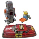 Three vintage tinplate toys, to include: - Dibro Fire Chief car - Yoneya Robot - Cat with