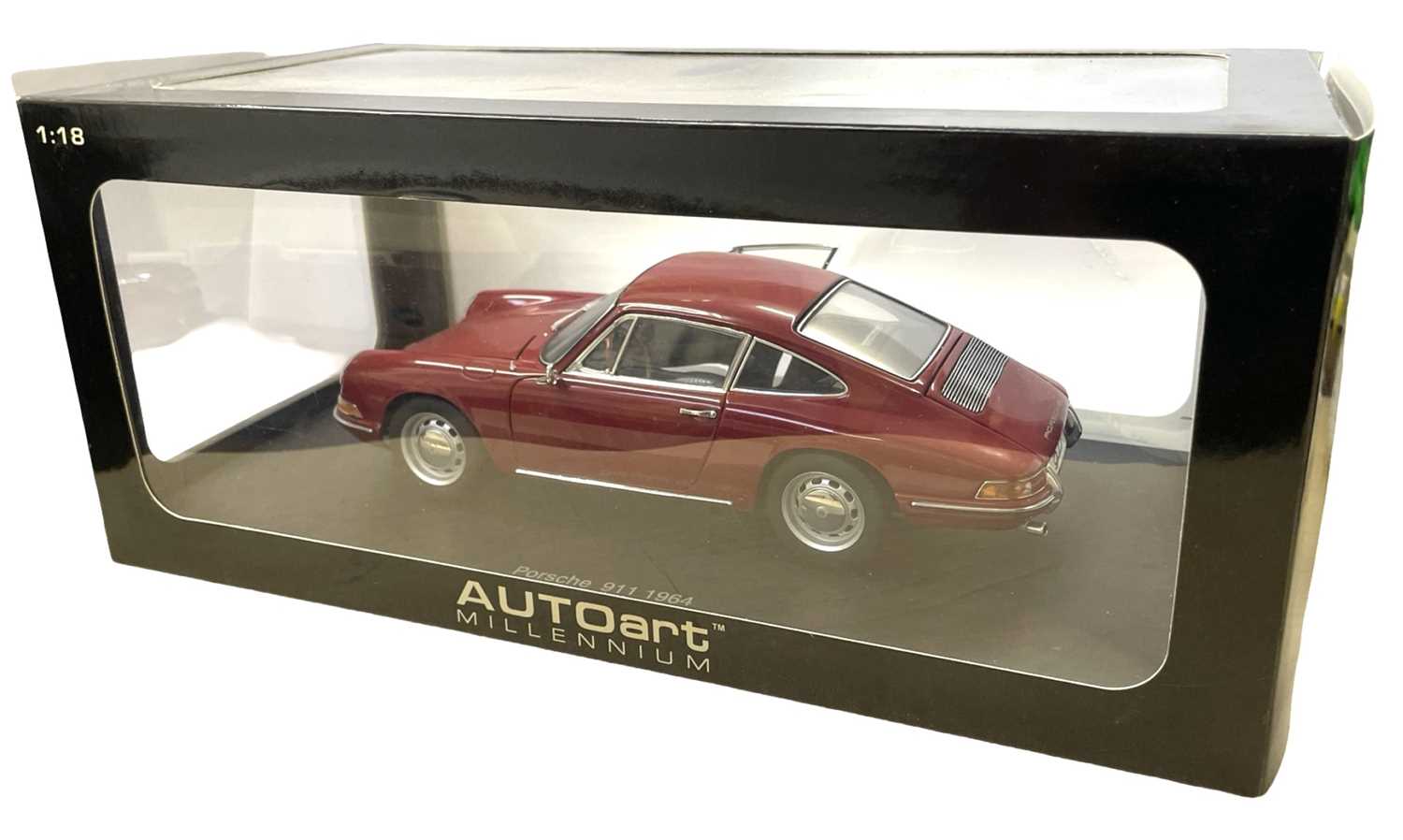 A boxed AutoArt 1:18 scale Porsche 911 1964 in deep red