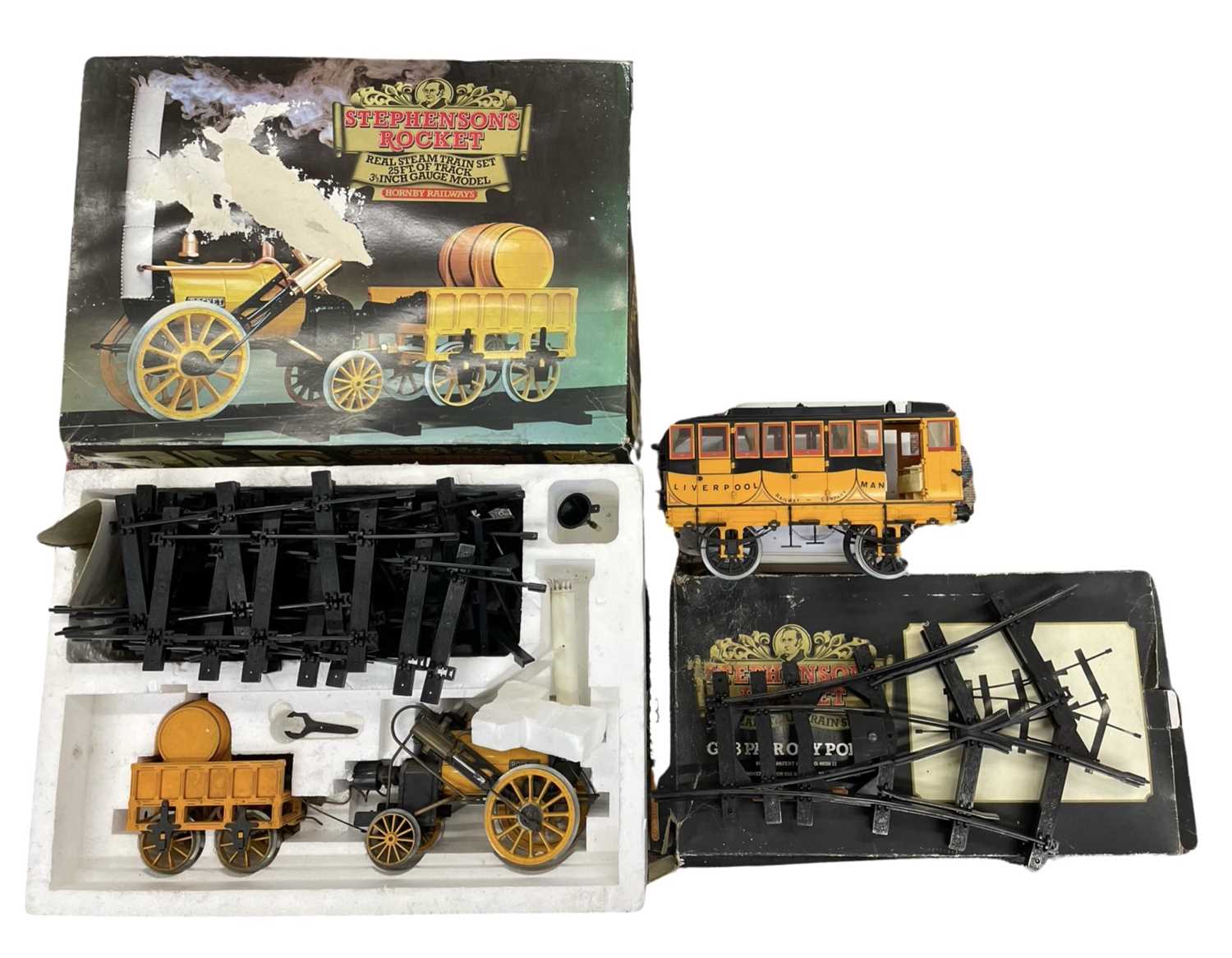 A boxed Hornby G100 3 1/2'' gauge Stephensons Rocket real steam train set, together with G103 Pair