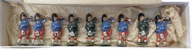 A collection of vintage, unmarked die-cast Highland Soldiers.
