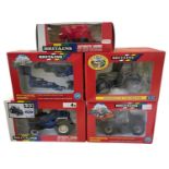 Five boxed Britains 1:32 scale tractors and farm machinery, to include: - Hurlimann SX 1500 - Ford