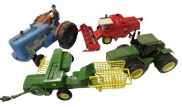 Four large scale model agricultural vehicles, to include: - John Deere tractor - Britains 1978