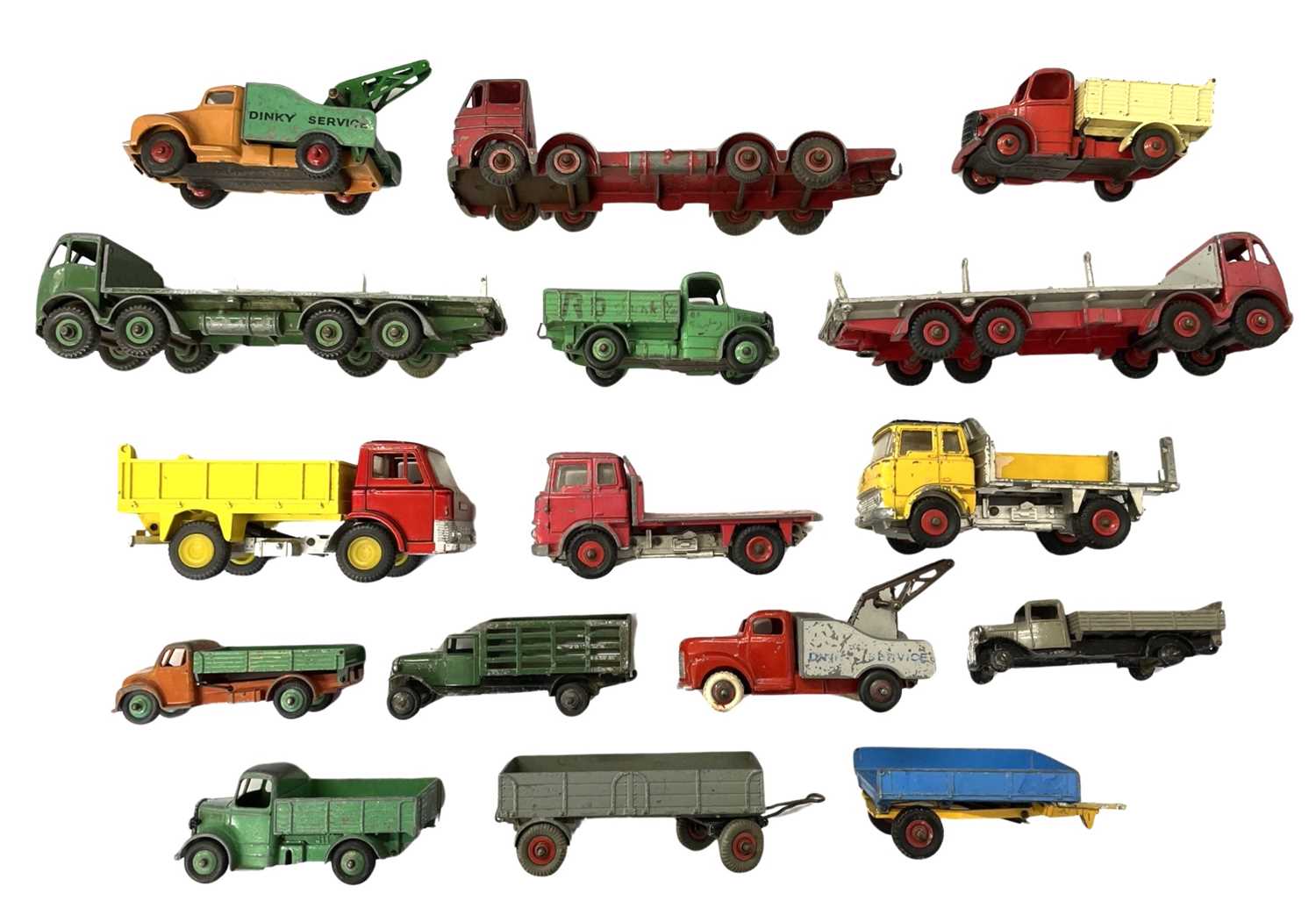 A collection of various die-cast Dinky flatbed trucks