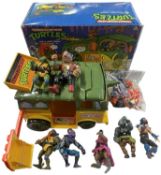 A boxed 1980s Teenage Mutant Ninja Turtles Turtle Party Wagon, together with various figures