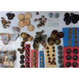 A quantity of assorted buttons to include jet, carved bone, military, enamel, metal and others