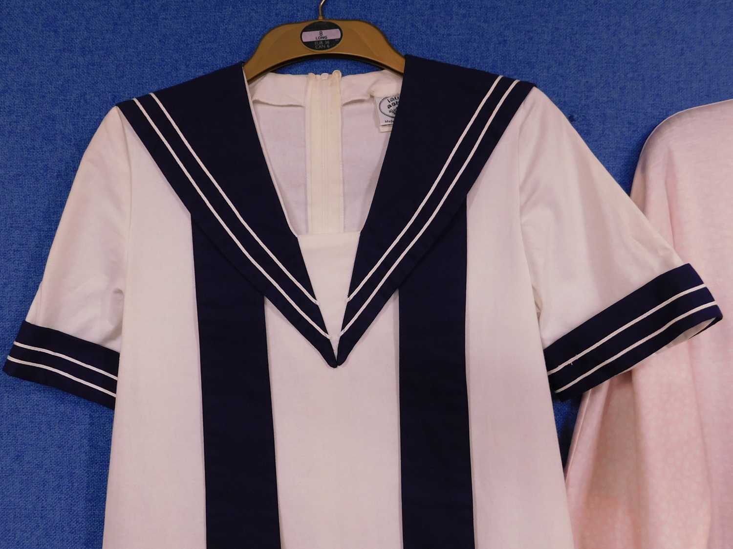 Two Laura Ashley dresses to include a cream and navy blue sailor dress and a pink and white - Bild 2 aus 9