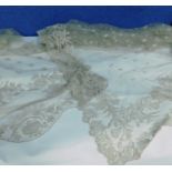 A quantity of Nottingham lace to include a square lace shawl approx 120cm square and a length of