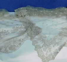 A quantity of Nottingham lace to include a square lace shawl approx 120cm square and a length of