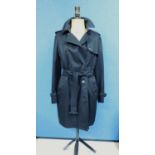 A lady's black Aquascutum trenchcoat, the double breasted coat with belted/tie waist, custom