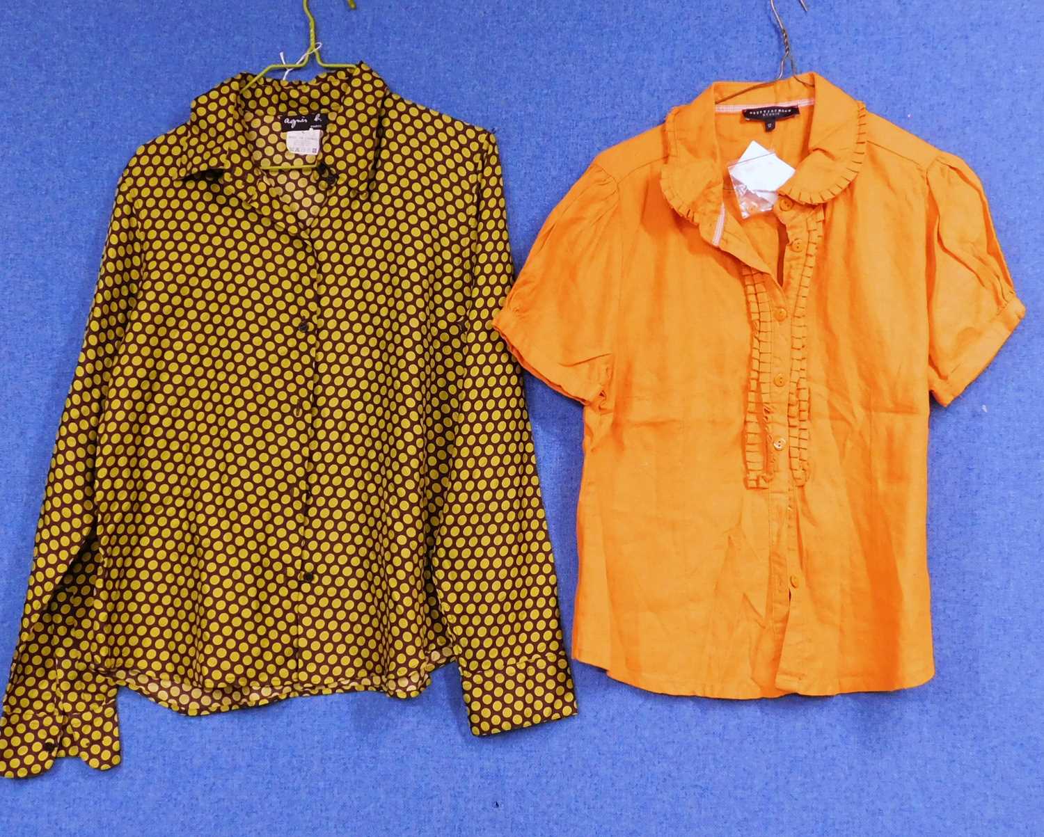 An Agnes B polka dot silk blouse together with an orange short sleeve cotton shirt by Betty Jackson,