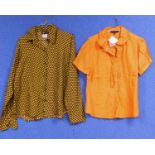 An Agnes B polka dot silk blouse together with an orange short sleeve cotton shirt by Betty Jackson,