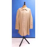 A gentlemans beige Burberry coat, single breasted button front, with button placket, side pockets,