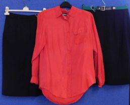 A red silk shirt by Diane Gilman, size M, together with two navy blue skirts by Basler, (3)