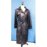 A lady's full length brown leather coat by Higgs, double breasted with front pockets and tie