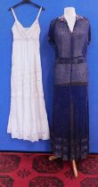 A navy blue chiffon heavily beaded dress with matching tie belt, together with a cream cotton