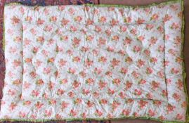 A green and floral patterned cotton eiderdown, approx. 190cm x 130cm few loose threads to green
