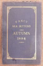 A late Victorian tradesman's four fold cased set of sample buttons, 'Fancy Silk Buttons, Autumn