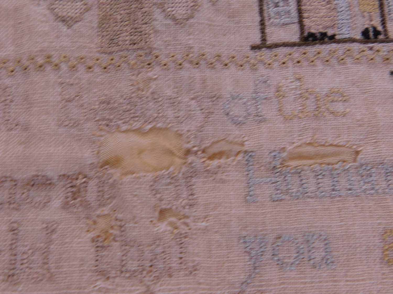 A Georgian needlework sampler, with rows of religious text, animals and buildings, named 'Ann - Image 5 of 6