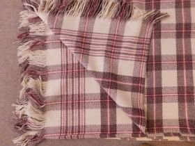 A Welsh blanket, in cream, brown and red check, fringed edging on two sides, approx. 200 x 220cm