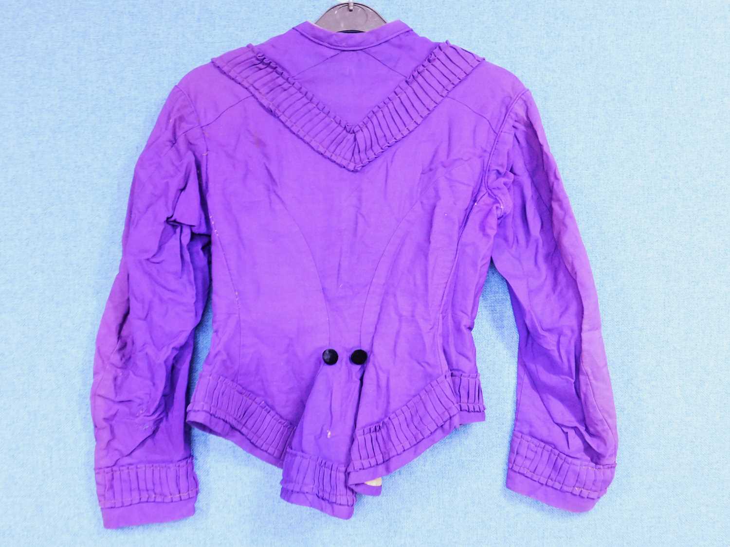 A late 19th century lady's purple jacket, with covered black velvet buttons, peplum waist and - Image 2 of 2