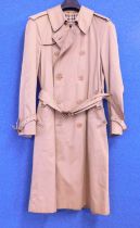 A gentleman's Aquascutum 'Aqua 5' trenchcoat, double breasted with leather buckle belt and cuff