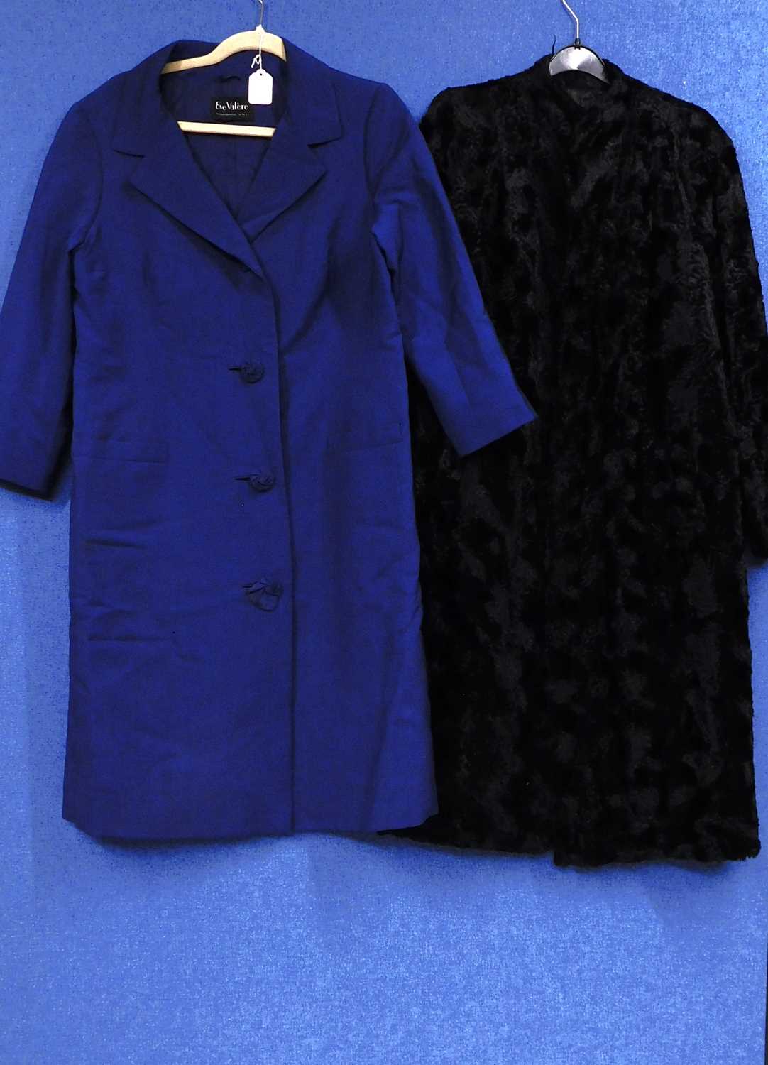 Two ladies mid 20th Century coats to include a navy blue single breasted coat by Eve Valere and a