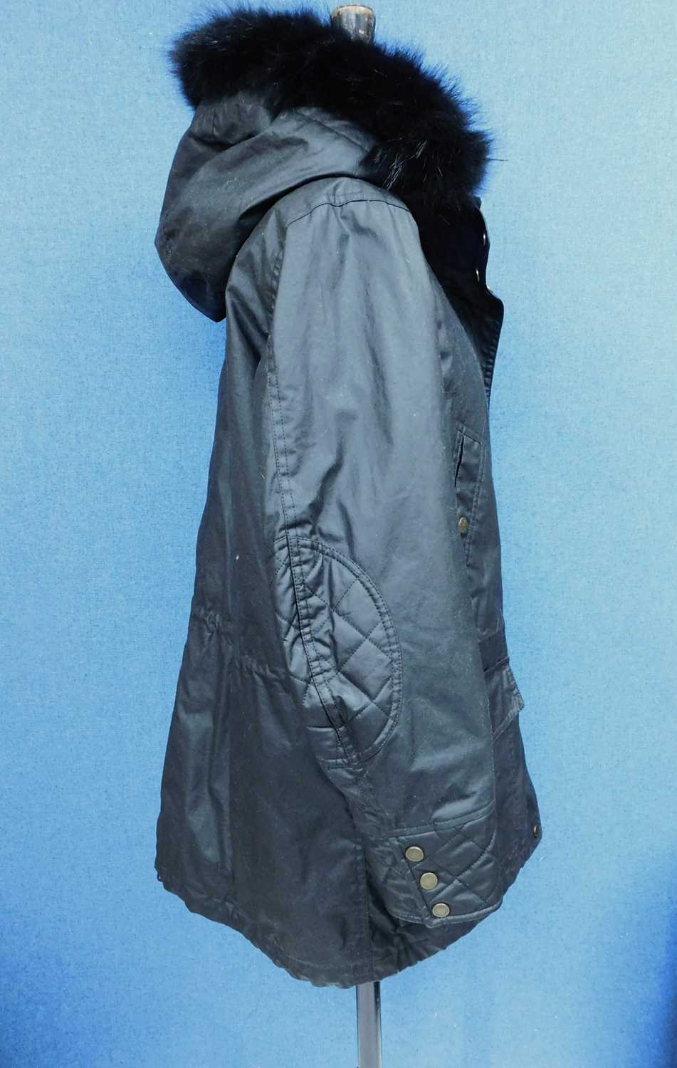 A lady's black Belstaff hooded parka, zip fronted with storm flap and popper fastening, front - Image 3 of 9
