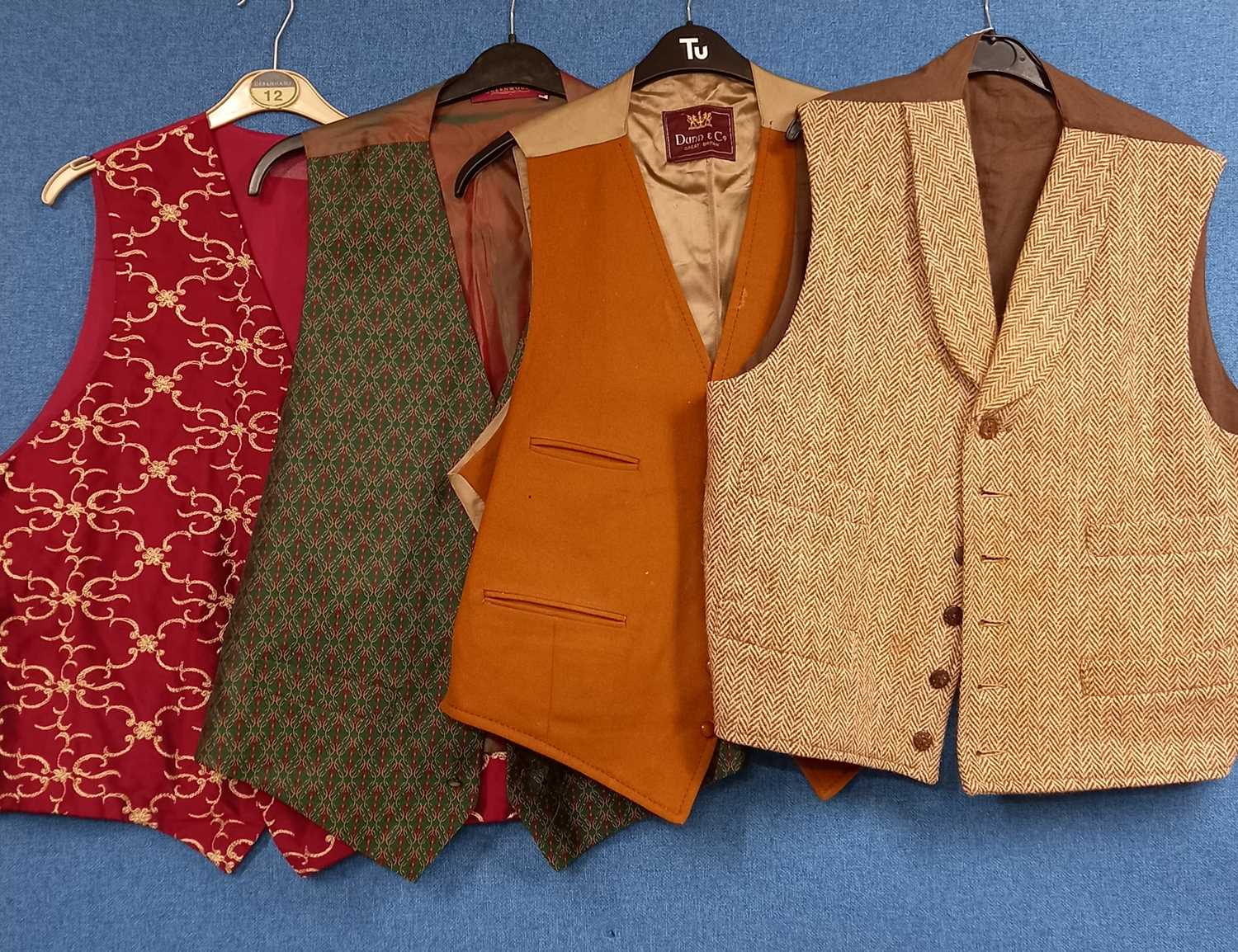 Four gentlemens waistcoats to include one in brown tweed, tan moleskin by Dunn & Co, red brocade and