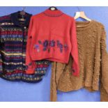 Three items of ladies knitwear to include a blue patterned cardigan by Laura Ashley, a cropped red
