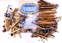 A quantity of wooden and bone lace bobbins, together with 'Pillow Lace and Bobbins' by Jeffrey