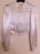 A 1930-40's cream satin blouse, V-neck with cutwork detail to front and back, with gathered body,