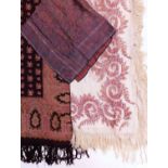 A cotton printed paisley shawl, a woven paisley silk scarf, a cream fringed printed paisley shawl (